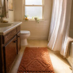 A rental bathroom featuring a cohesive color palette and stylish decor.
